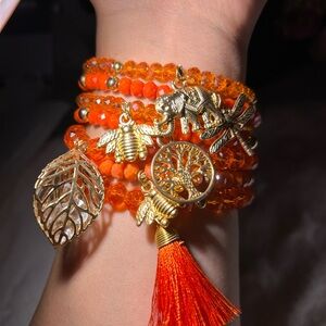 Artisanal Orange Beaded Bracelet with Gold Charms